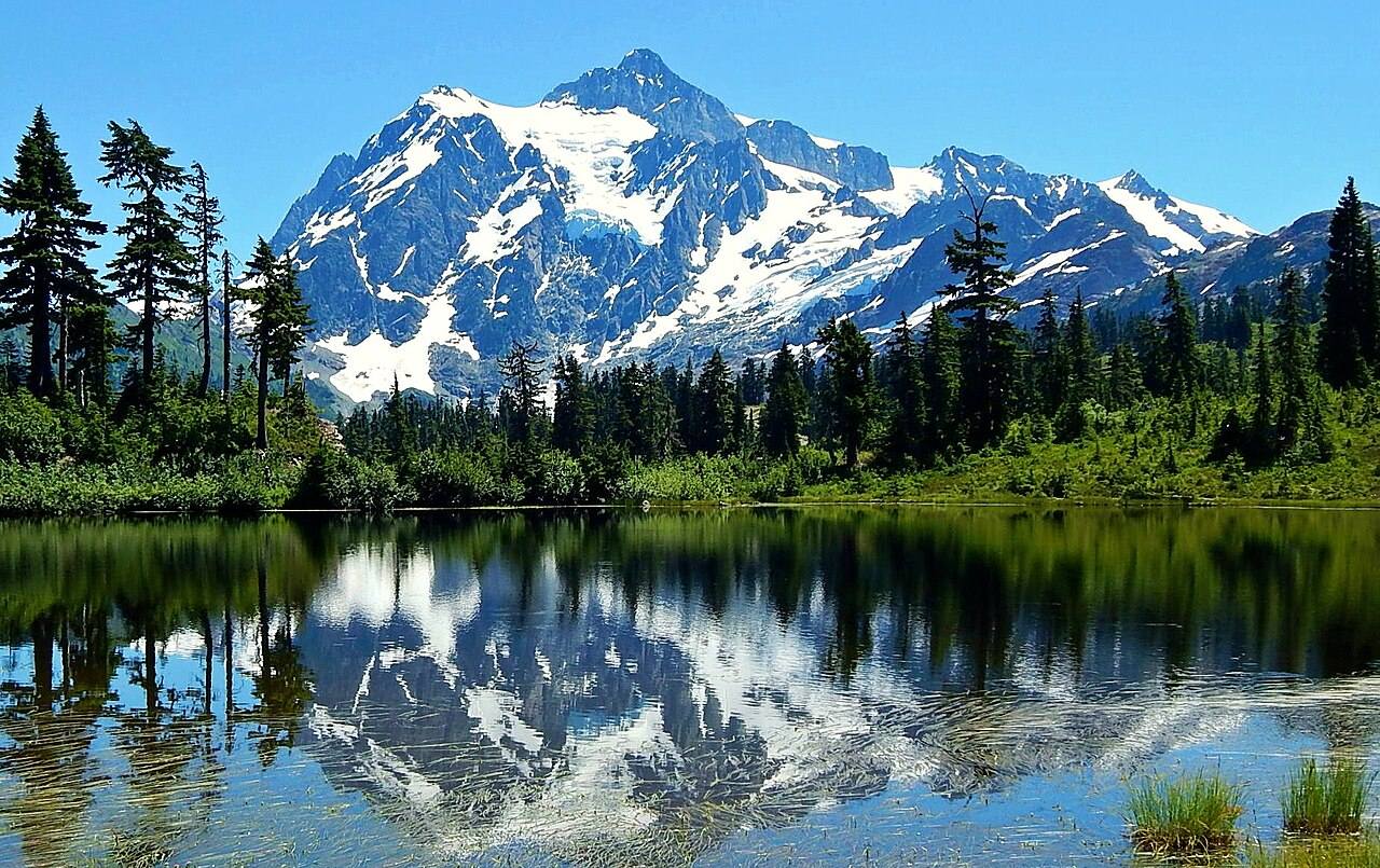 Mount Shuksan and its glaciers reflected in Picture Lake, North Cascades, Washington